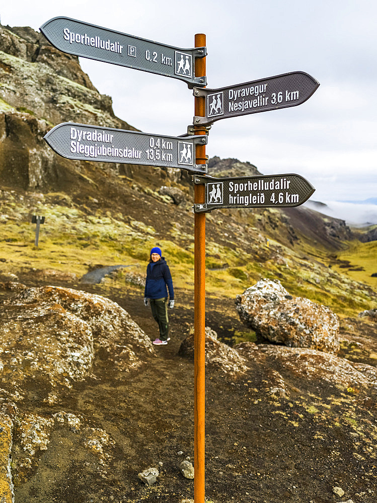 Female hiking on a trail in Southern Iceland; Grimsnes- og Grafningshreppur, Southern Region, Iceland