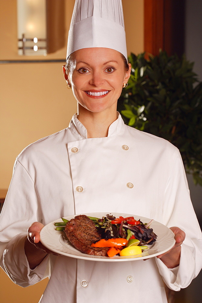 Chef Showing Off Her Plate Of Food