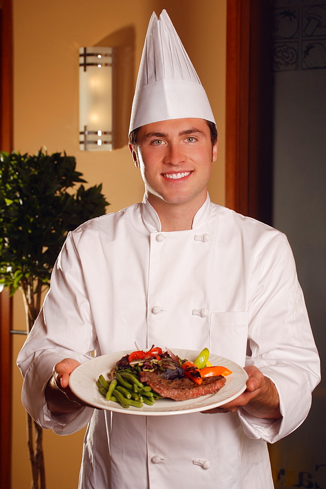 Chef Showing Off Plate Of Food