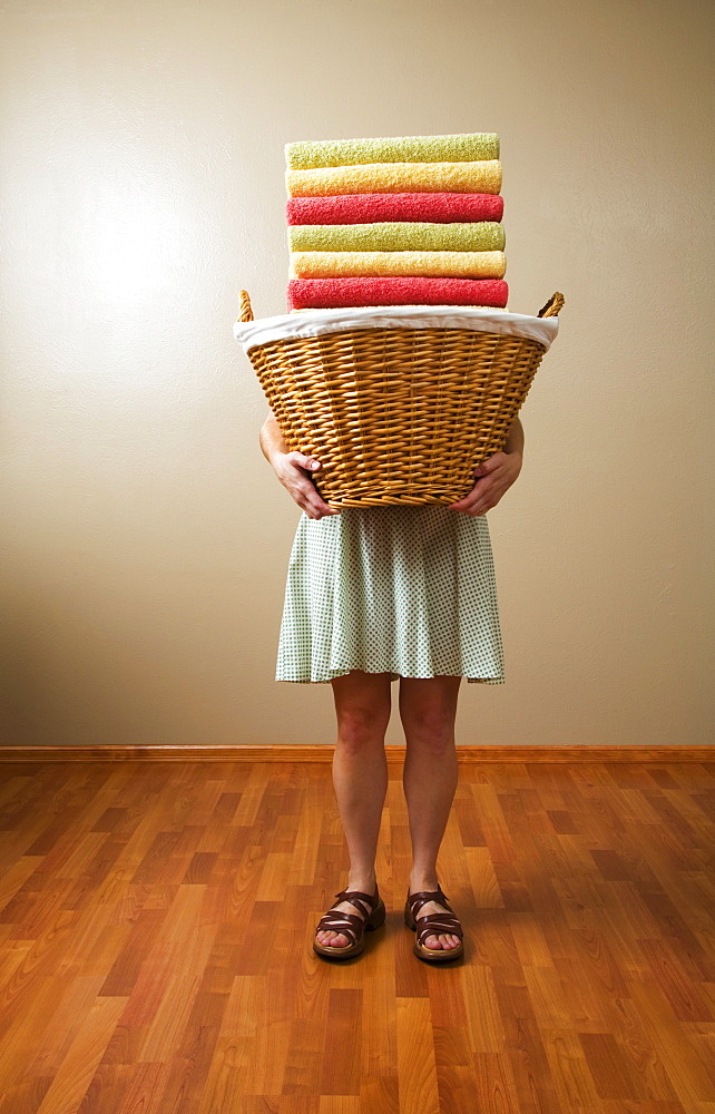 Woman Carrying A Laundry Basket