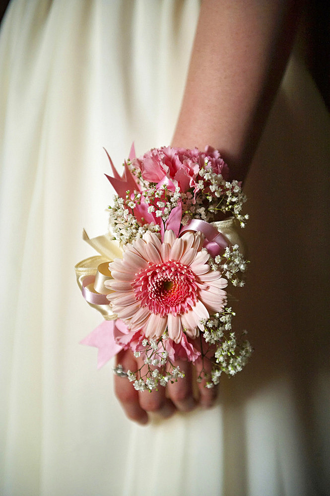 Beautiful corsage with pink blossoms on the wrist of a teenage girl going to her prom, Lincoln, Nebraska, United States of America