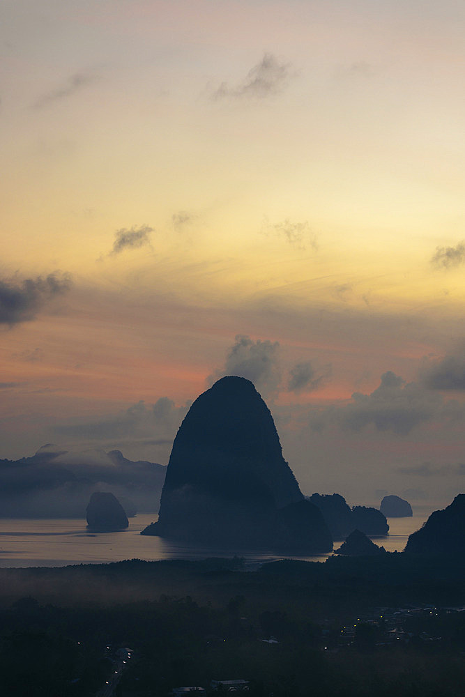 Silhouetted karst rock formations at sunset in Phang-Nga, Thailand, Ao Phang Nga, Phang-nga, Thailand