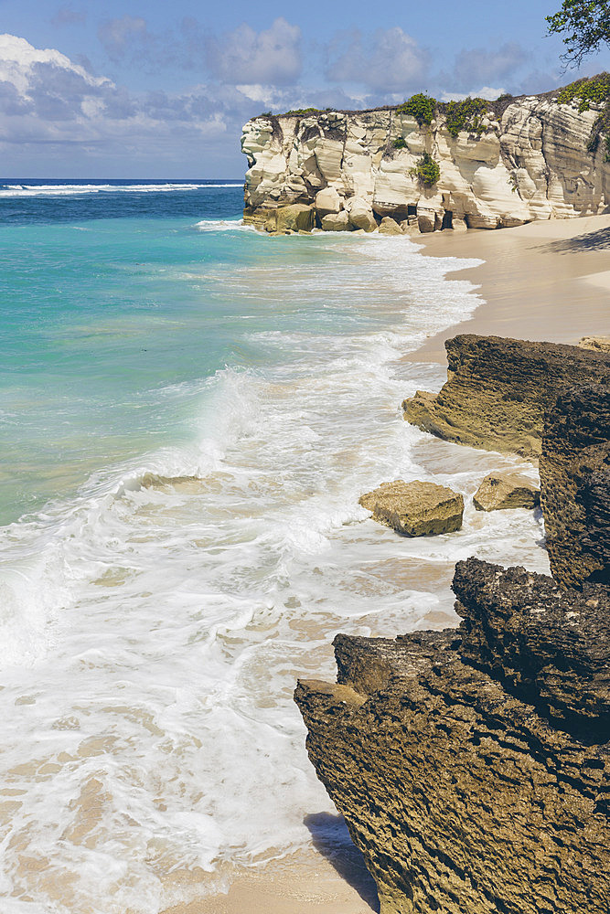 Pristine turquoise ocean water and white sand beach on an island in the Indian Ocean, Southeast Asia, Patiala Bawa, Lamboya, West Sumba Regency, East Nusa Tenggara, Indonesia