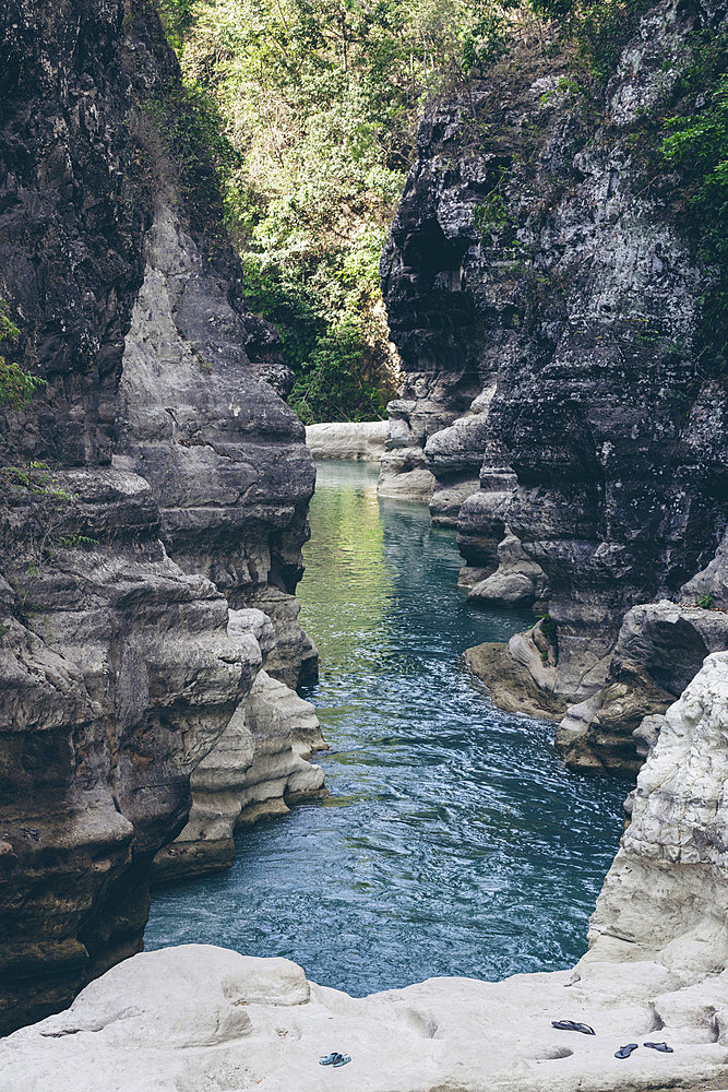 Tranquil water flows through a gorge at Air Terjun Tanggedu, Indonesia, Ndapayami, Kanatang, East Sumba Regency, East Nusa Tenggara, Indonesia