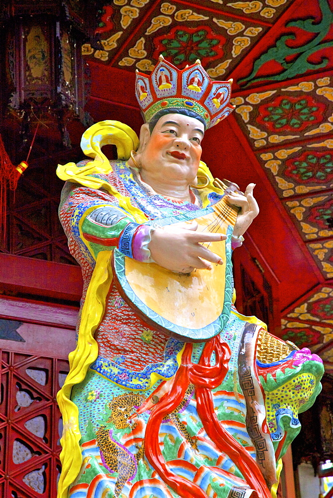 Statue of Dhrtarastra, one of The Four Heavenly Kings at Wong Tai Sin Temple, Hong Kong, China, Asia