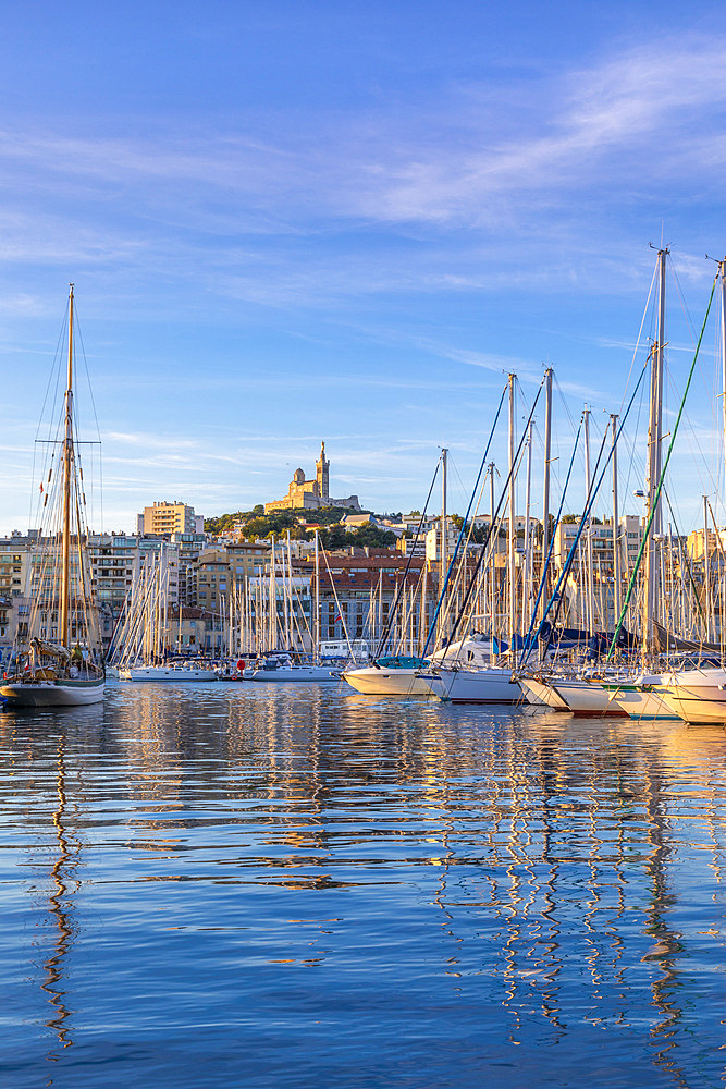 Marseille Harbour and Notre-Dame de la Garde at sunrise, Marseille, Bouches-du-Rhone, Provence-Alpes-Cote d'Azur, France, Western Europe