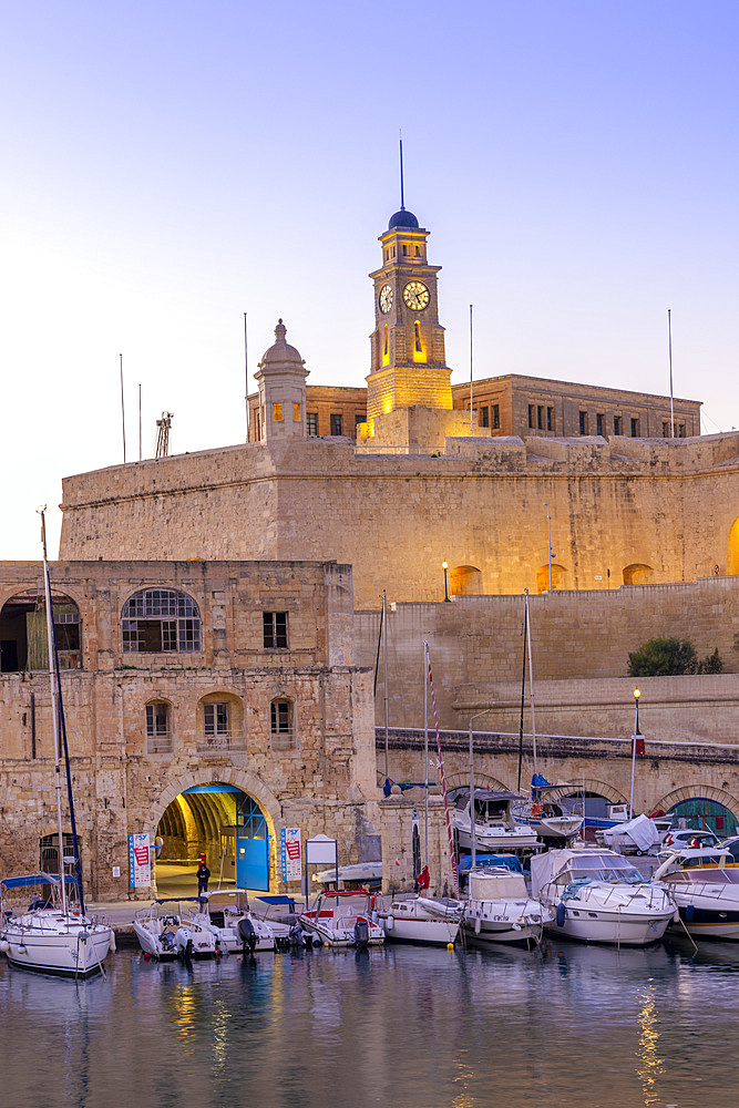 The Old Dock Buildings at Bormla Waterfront with the Fort St. Michael Clock Tower in the Background at Dusk, Cospicua, Malta, Southern Europe