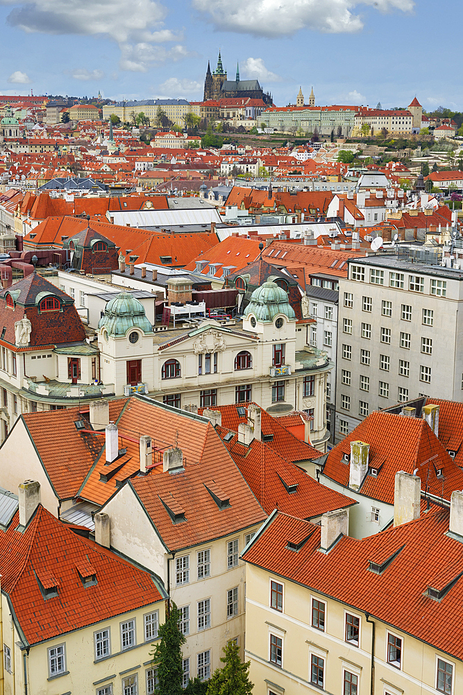 Aerial view over the red roofs of Prague, the Castle and the Cathedral, UNESCO World Heritage Site, Prague, Bohemia, Czech Republic (Czechia), Europe