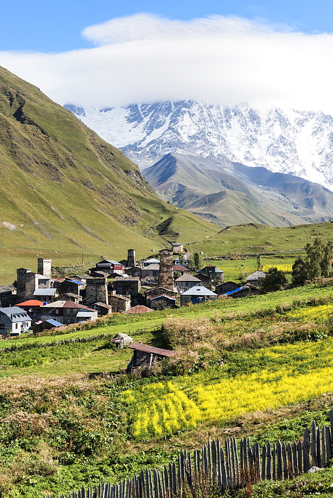 Traditional medieval Svanetian tower houses, Ushguli village, Shkhara Moutains behind, Svaneti region, Georgia, Caucasus, Asia