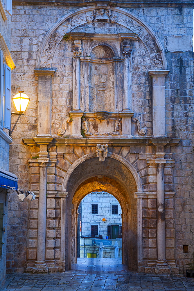 Land Gate illuminated at dusk, Stari Grad (Old Town), Korcula Town, Korcula, Dalmatia, Croatia, Europe