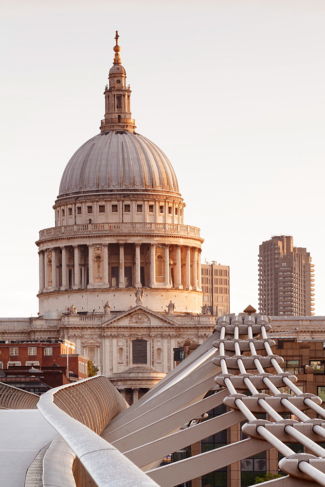 Millennium Bridge and St. Paul's Cathedral at sunrise, London, England, United Kingdom, Europe