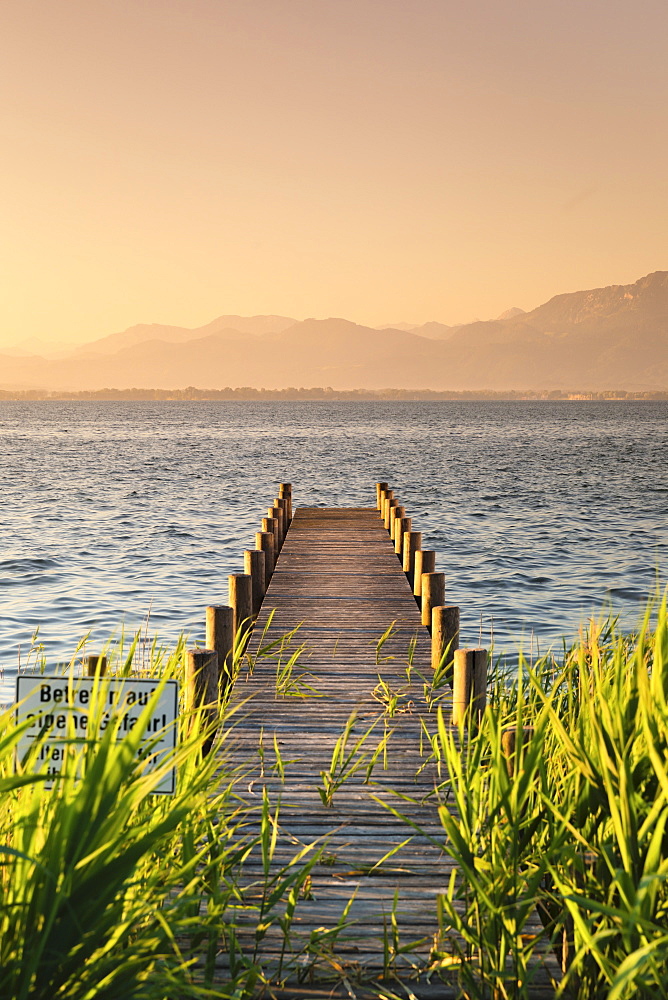 Jetty at sunrise, Gstadt am Chiemsee, Lake Chiemsee, Upper Bavaria, Germany, Europe