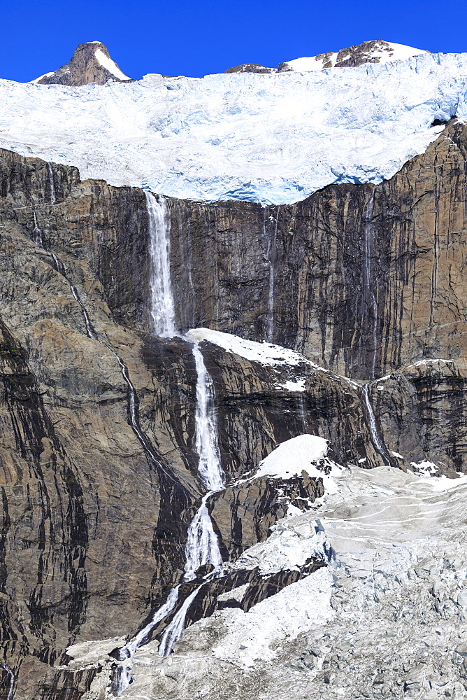 Glacier and waterfall, South Skjoldungen Fjord, Skjoldungen Island, glorious weather, remote South East Greenland, Denmark, Polar Regions