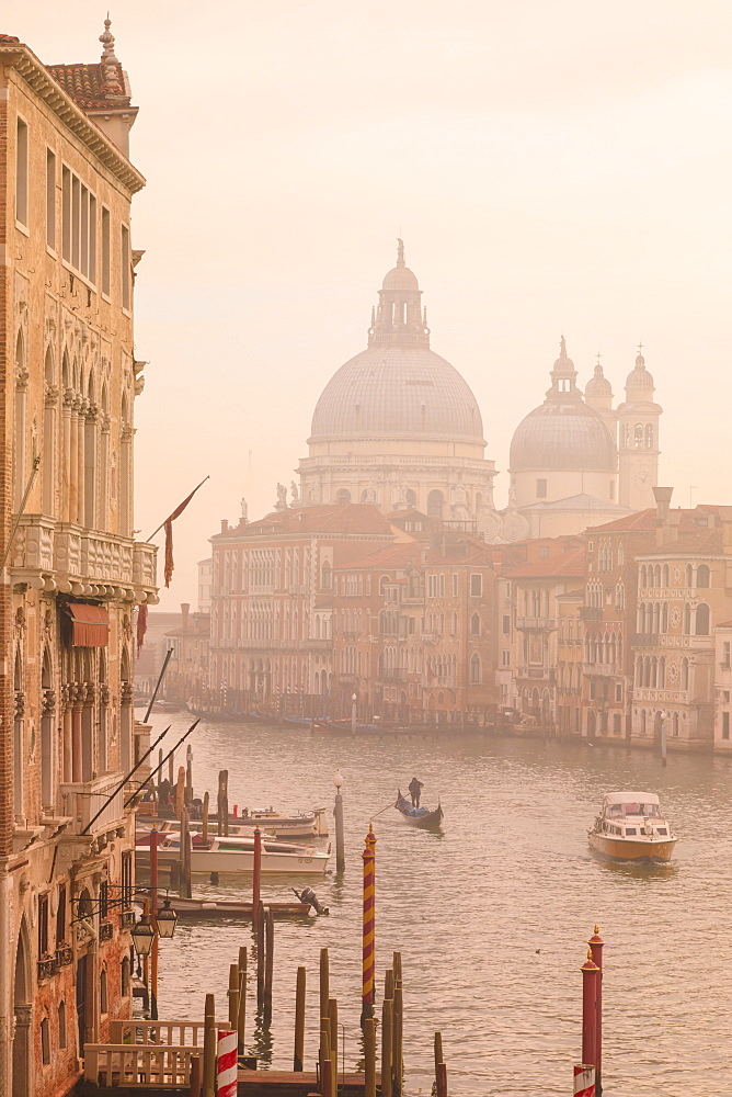 Beautiful Grand Canal, winter fog, morning golden light, Santa Maria della Salute, Venice, UNESCO World Heritage Site, Veneto, Italy, Europe