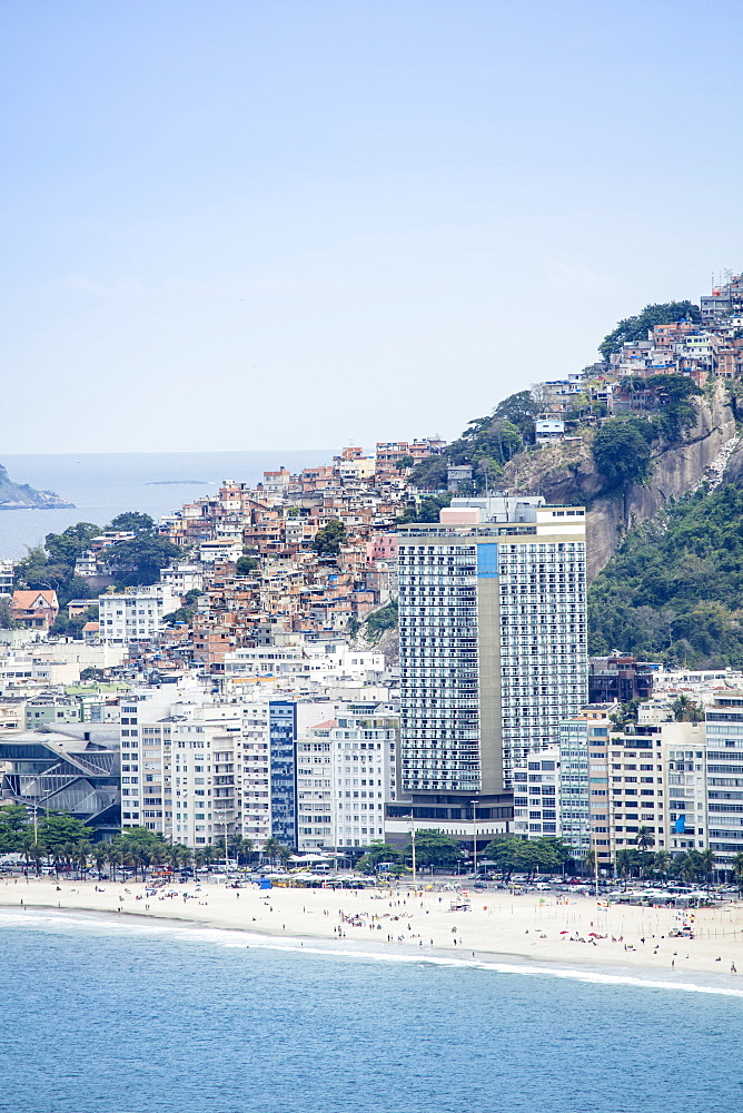 Elevated view of Copacabana Beach, apartment blocks and the Pavao Pavaozinhao favela slum, Rio de Janeiro, Brazil, South America