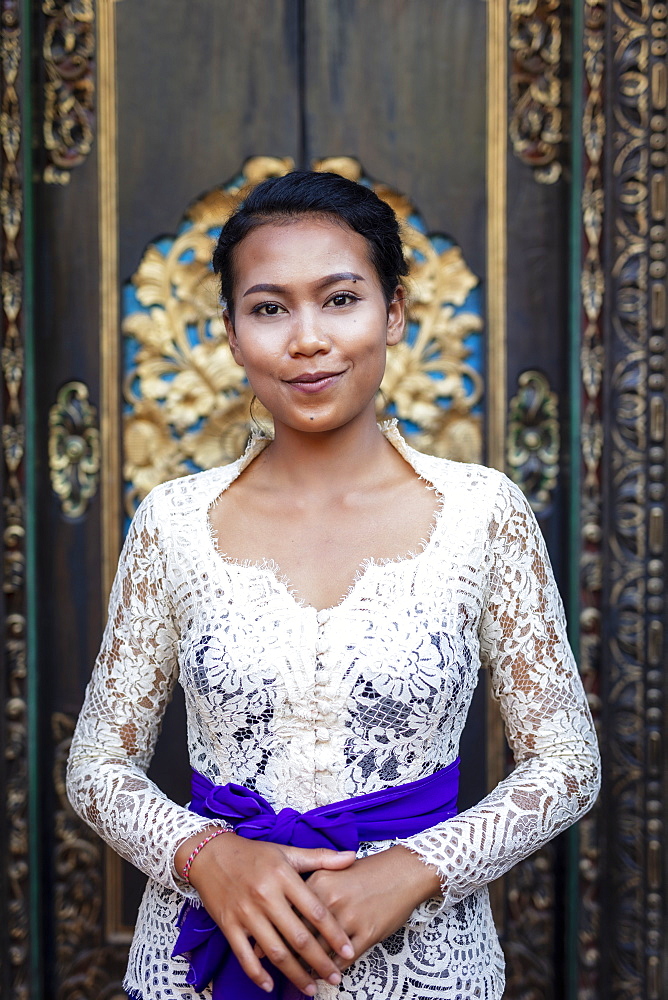 A beautiful local woman wearing traditional Balinese temple dress, Bali, Indonesia, Southeast Asia, Asia