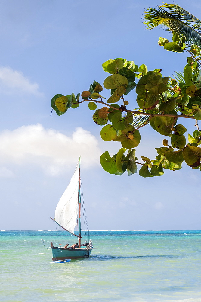 A traditional Caribbean wooden fishing sailboat in calm tropical sea, Nicaragua, Central America