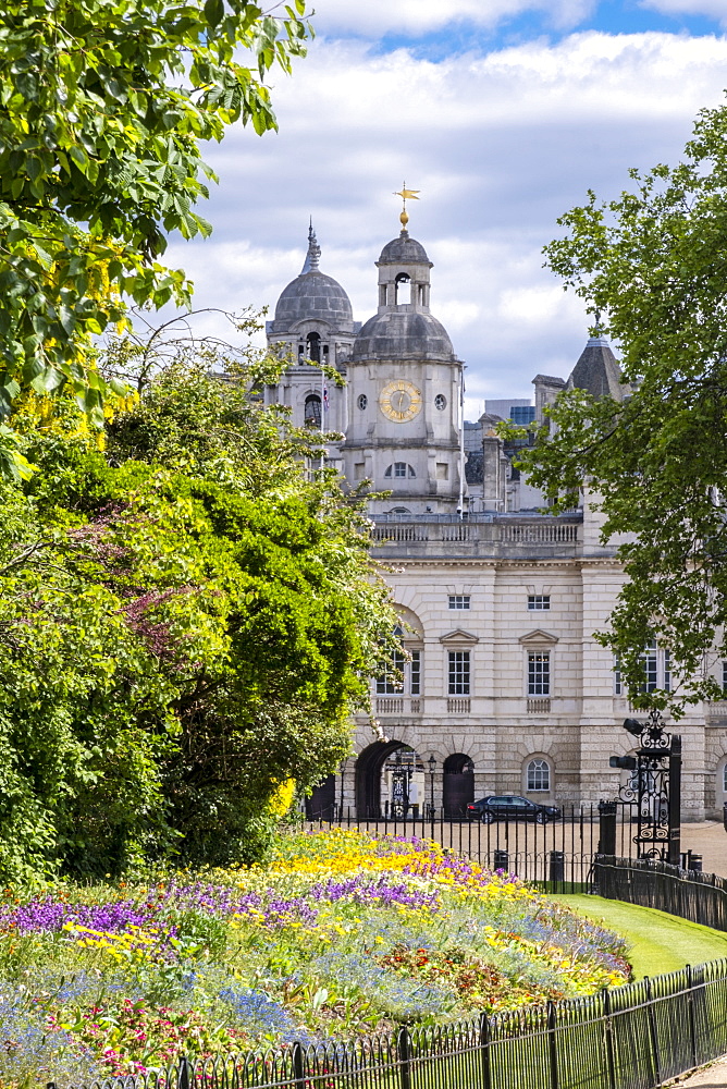 Horse Guards building from St. James's Park showing spring flowers in the flower beds, London, England, United Kingdom, Europe