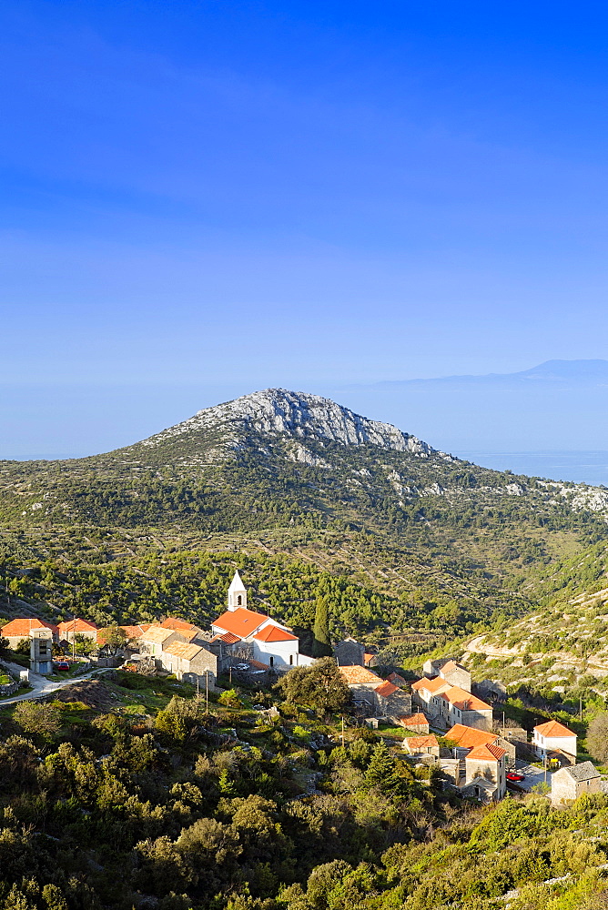 Velo Grablje village and mountains against the Adriatic Sea, Hvar Island, Dalmatia, Croatia, Europe