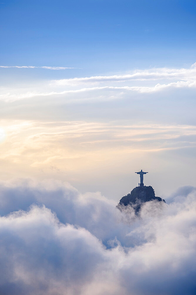 The Christ Statue (Cristo Redentor) on the summit of Corcovado mountain in a sea of clouds, Rio de Janeiro, Brazil, South America