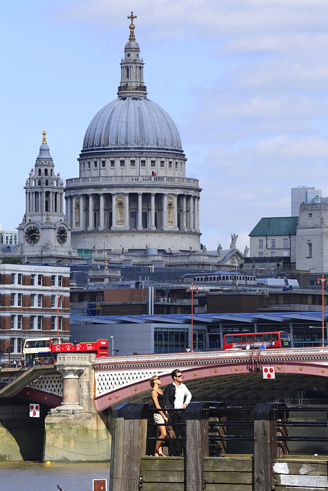 A couple standing on the South Bank with St. Paul's Cathedral behind, London, England, United Kingdom, Europe