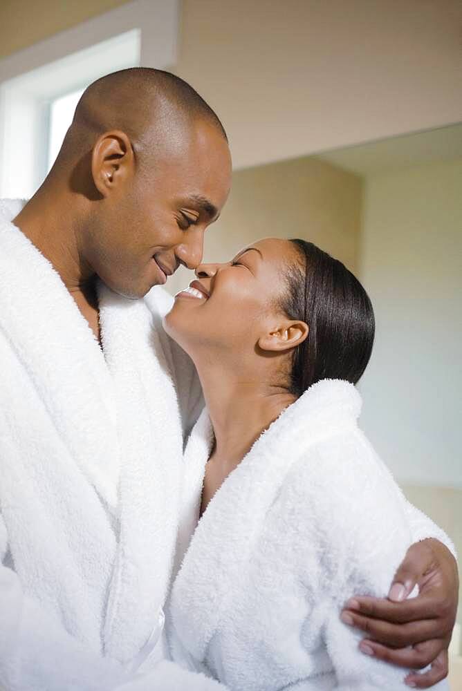 African couple smiling at each other