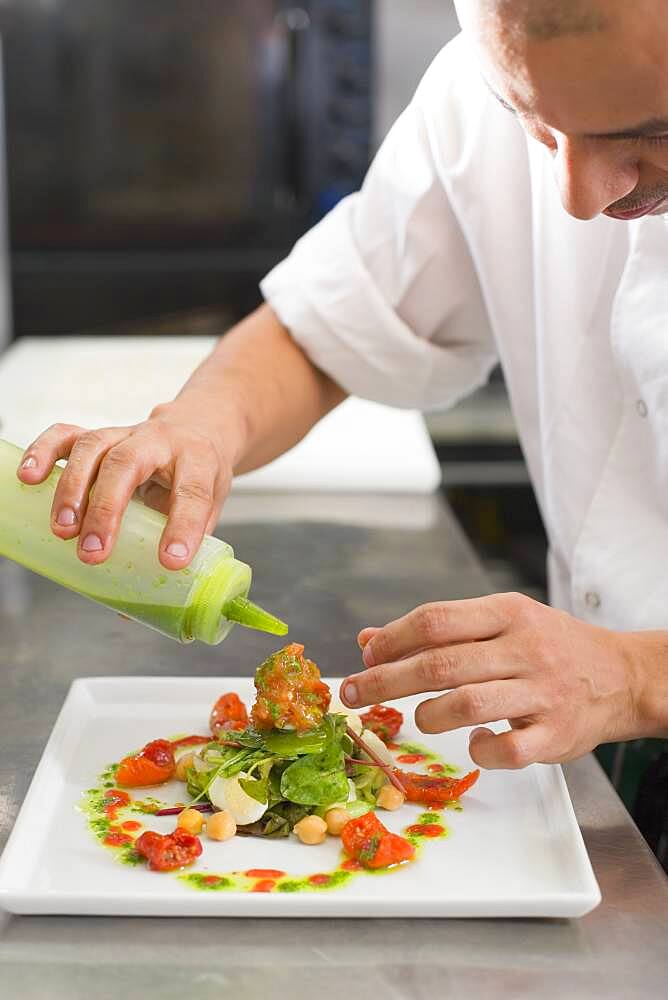 Hispanic male chef preparing food