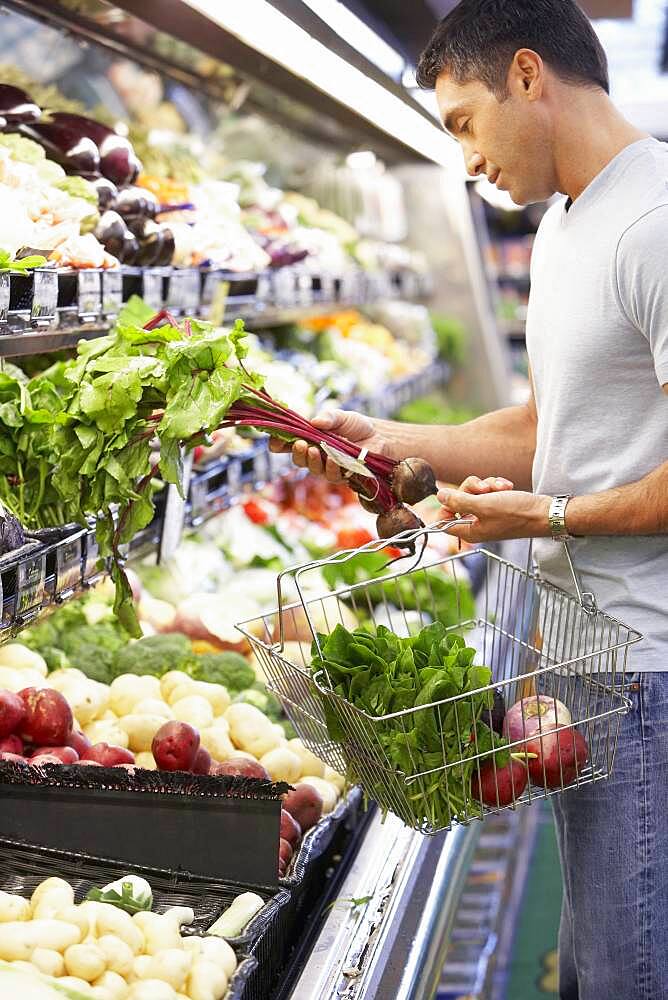 Hispanic man shopping for produce