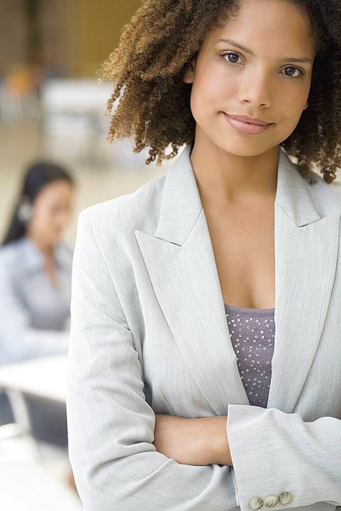 African businesswoman with arms crossed