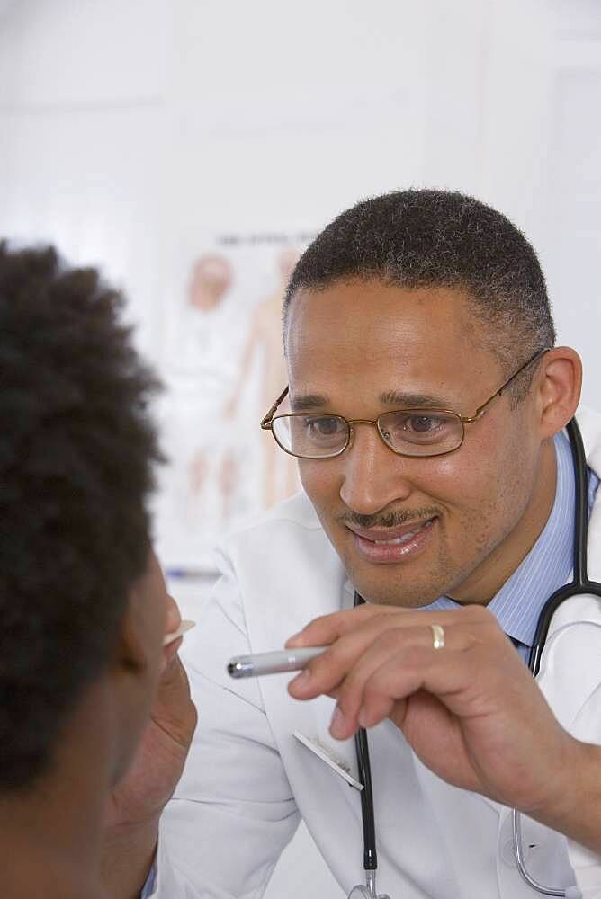 Female doctor putting on surgical gloves