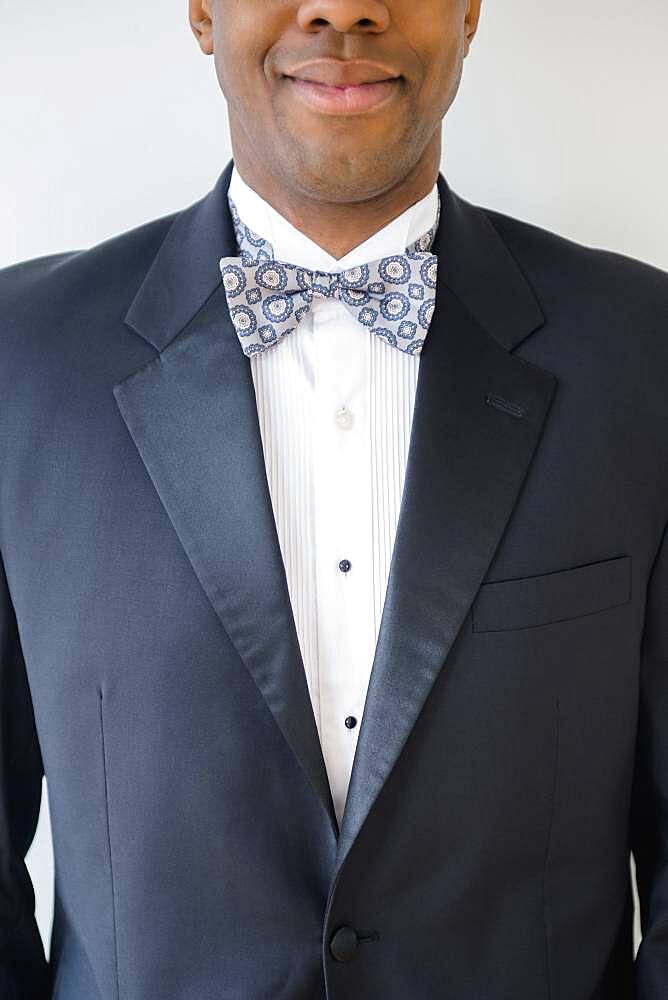 Close up of smiling groom wearing tuxedo