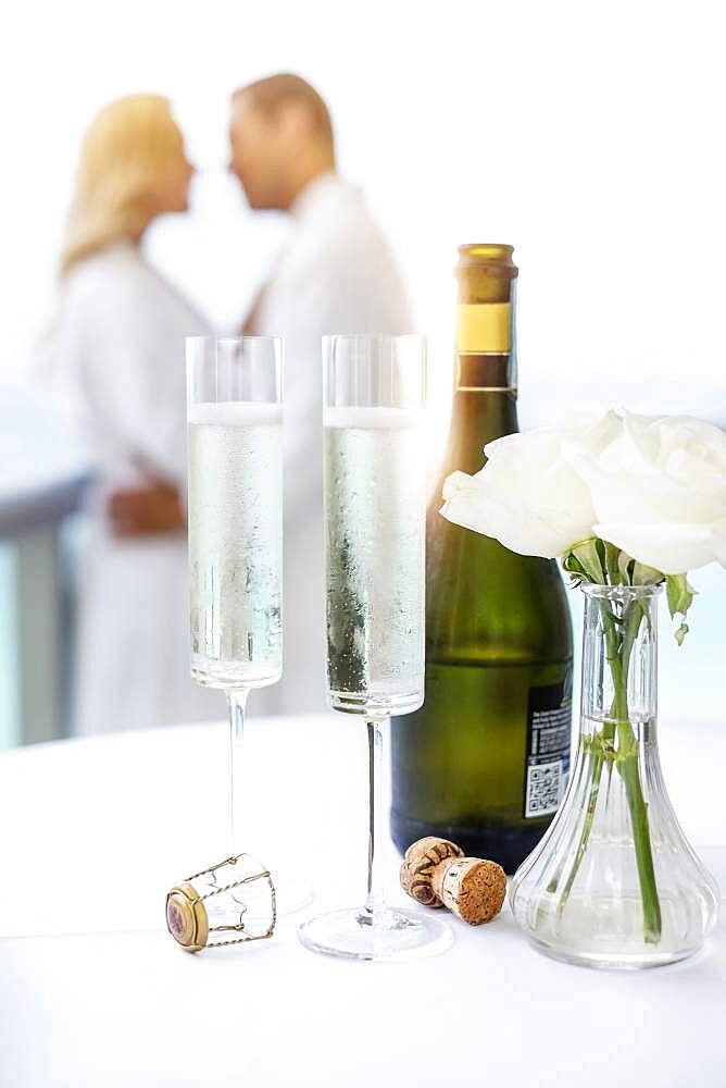 Close up of champagne glasses on balcony table