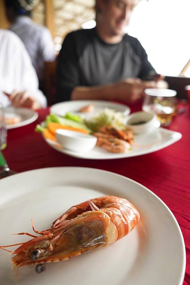 Close up of plate of shrimp on restaurant table