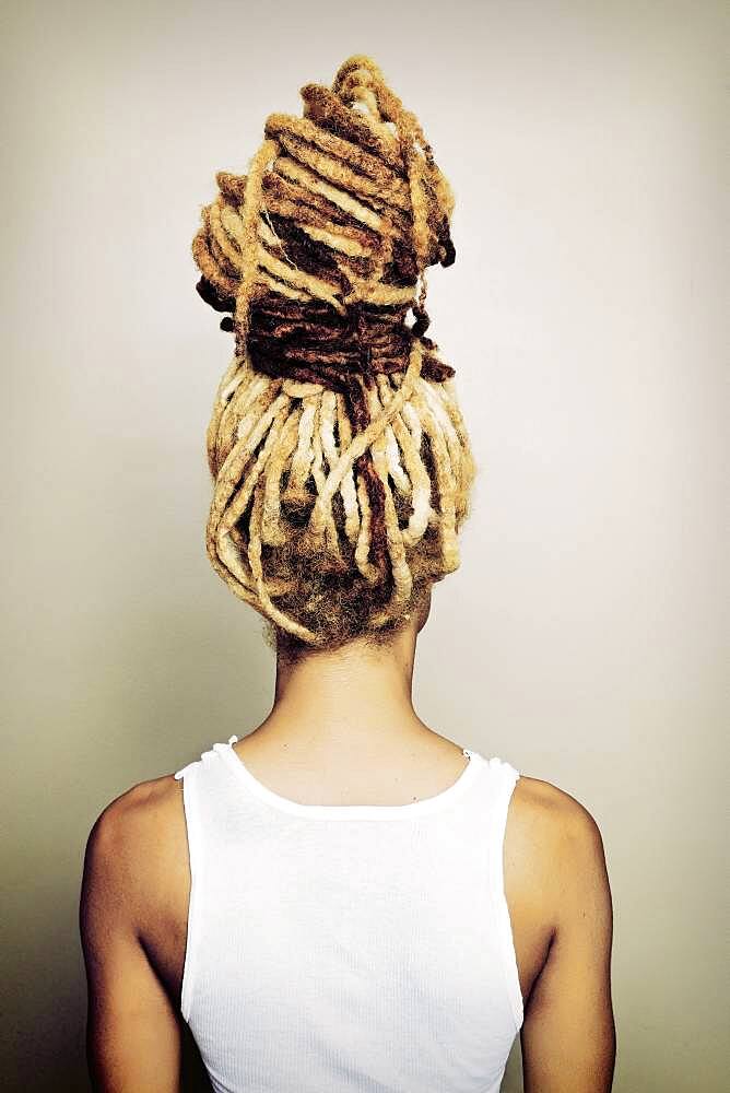 Black woman with dreadlocks bun