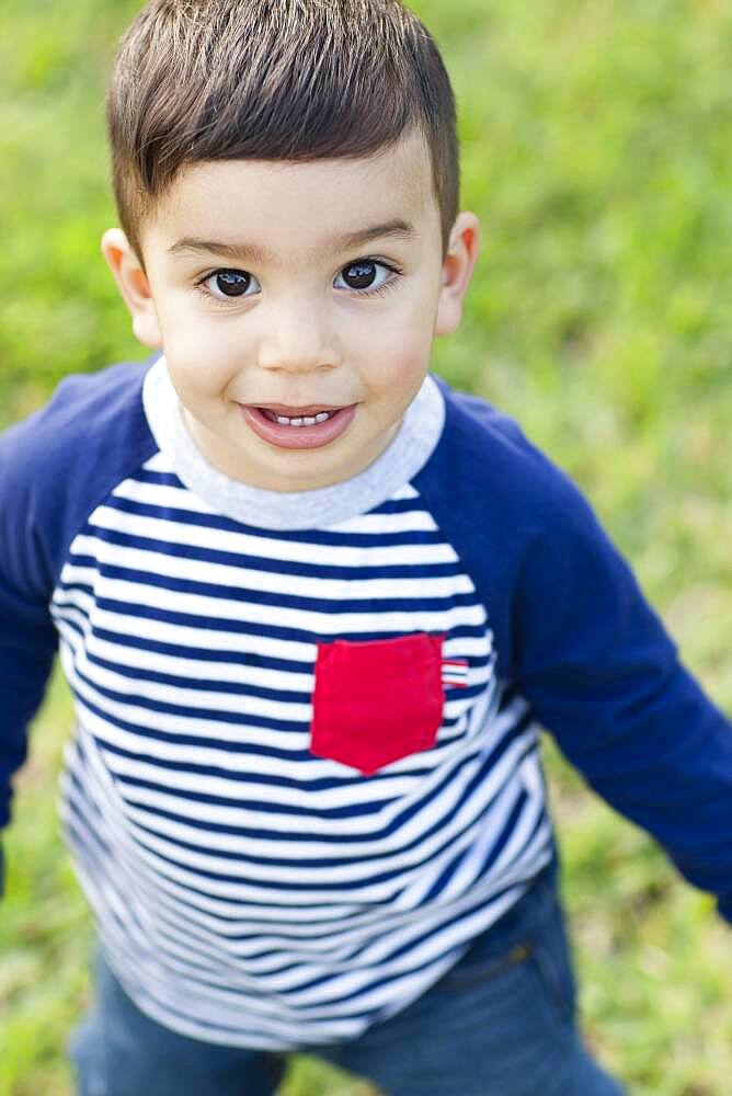 Close up of Hispanic boy outdoors