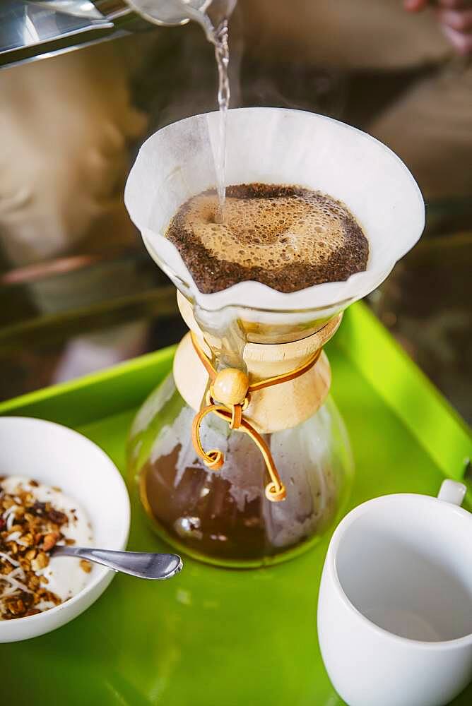 Caucasian man pouring breakfast coffee