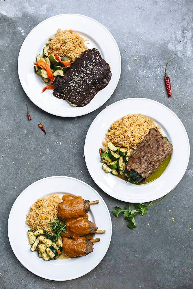 Plates of food with vegetables and rice