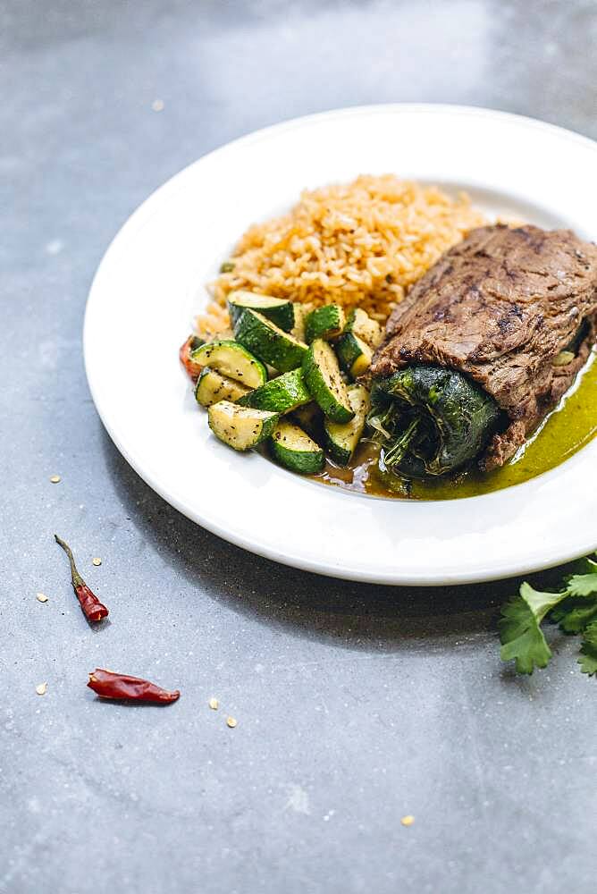 Plate of grilled pepper with vegetables and rice