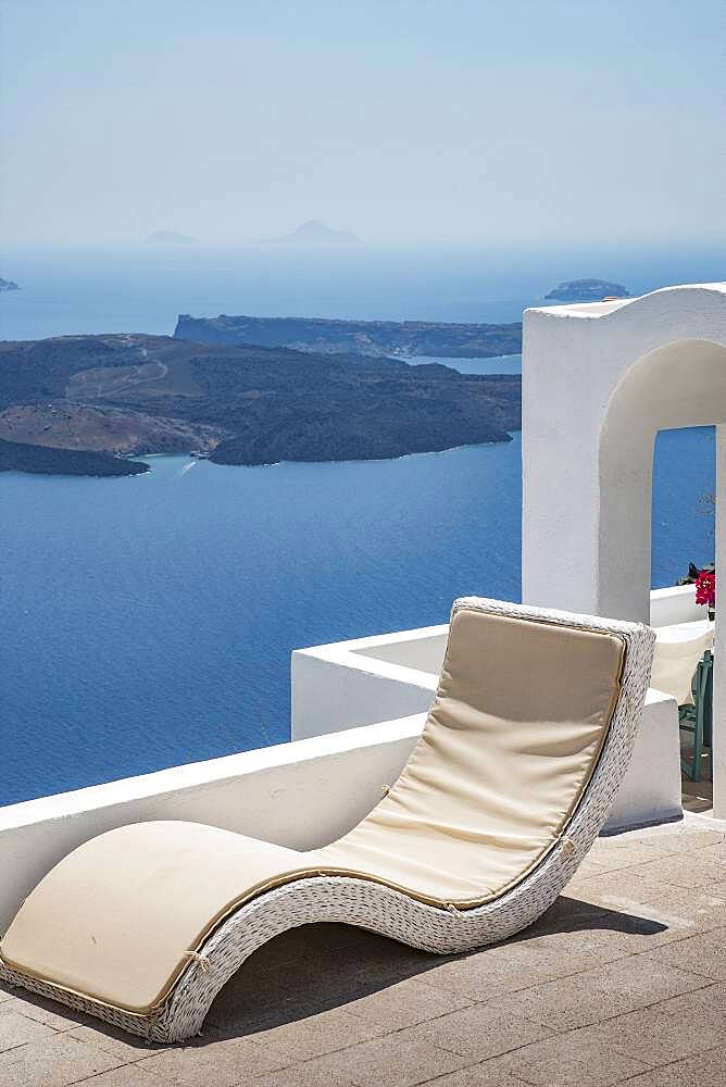 Lawn chair on hilltop overlooking ocean