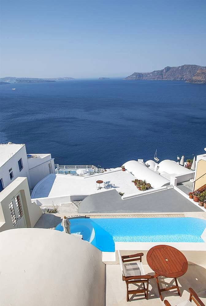 Rooftop swimming pool over Santorini bay, Cyclades, Greece