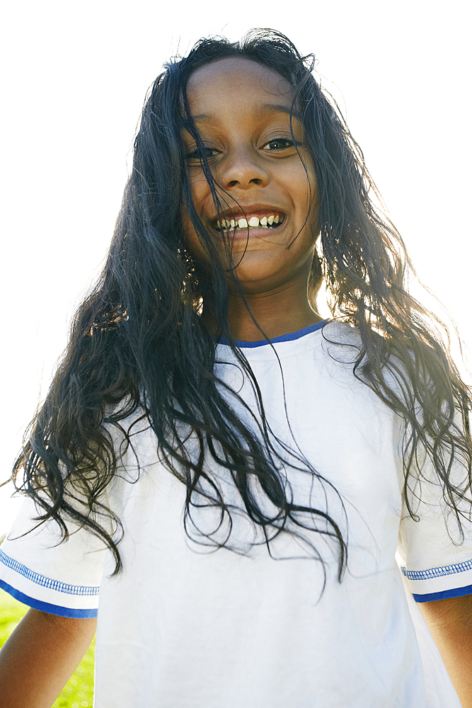 Portrait of smiling mixed race girl with long hair