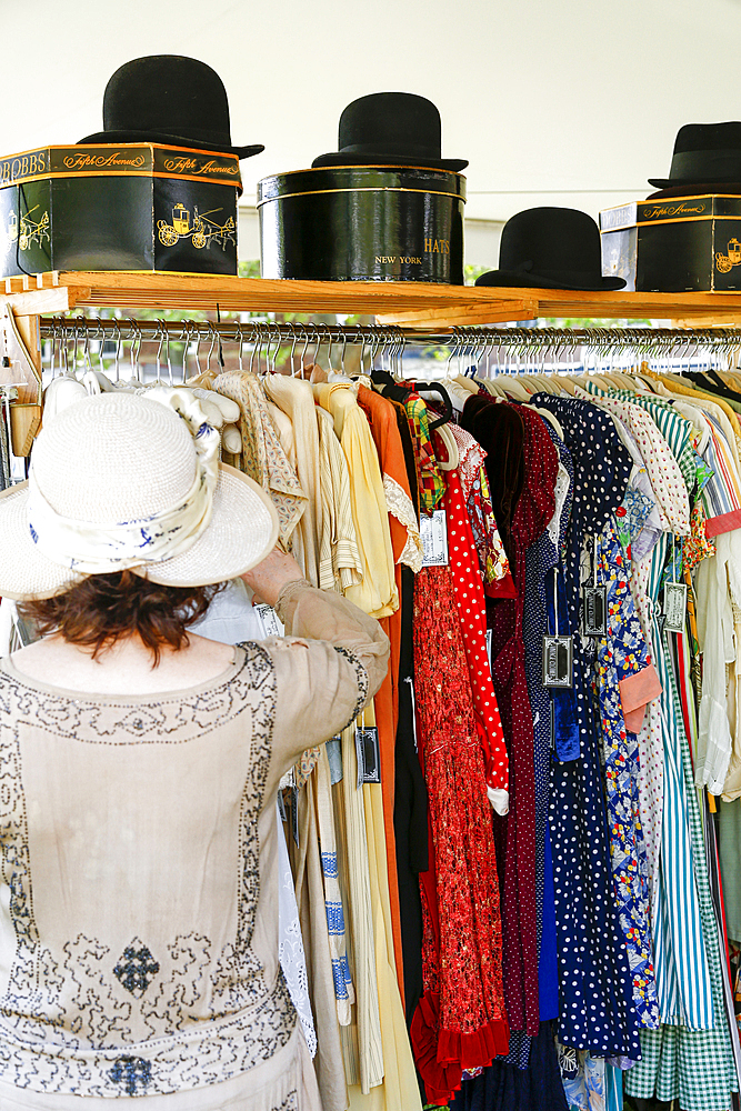 Woman shopping for dress in store