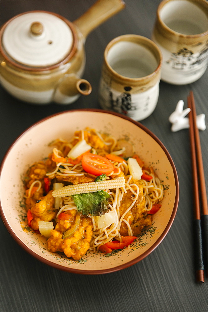 Chopsticks near a bowl of food