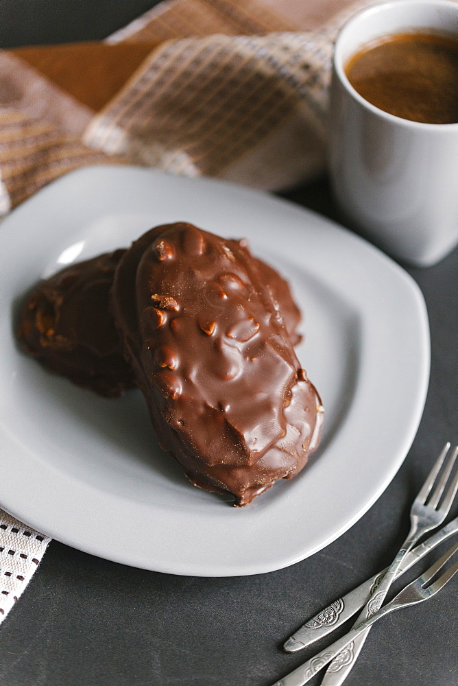 Chocolate cookies with nuts on plate