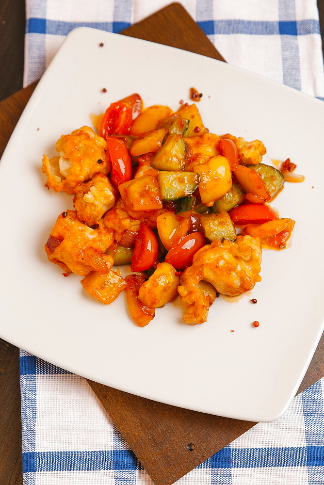 Orange chicken with tomatoes