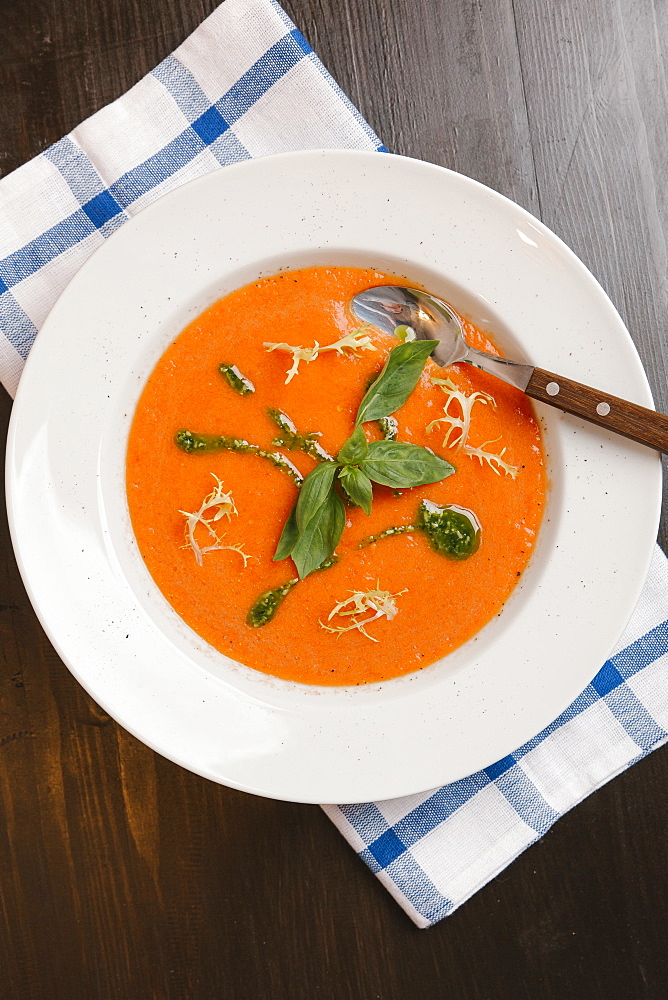 Basil in bowl of tomato soup