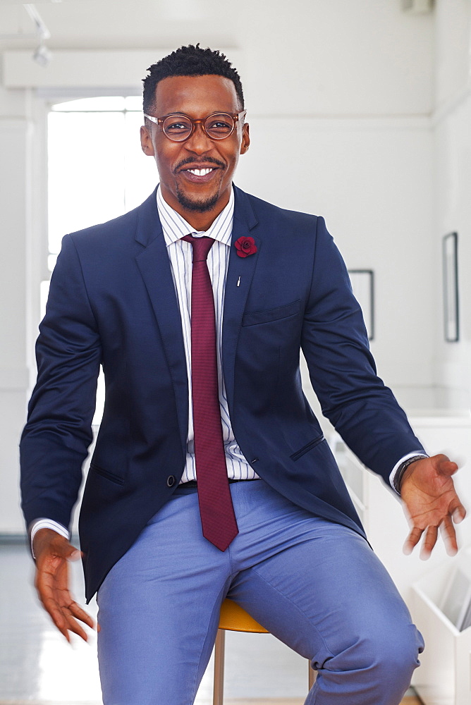 Black man gesturing in gallery