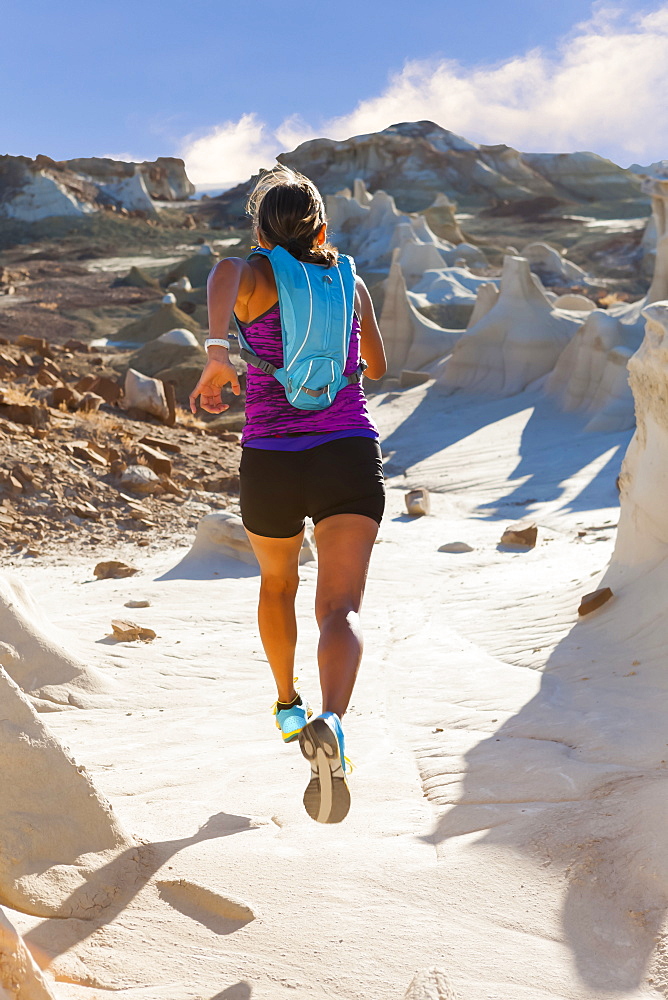 Native American woman running in desert