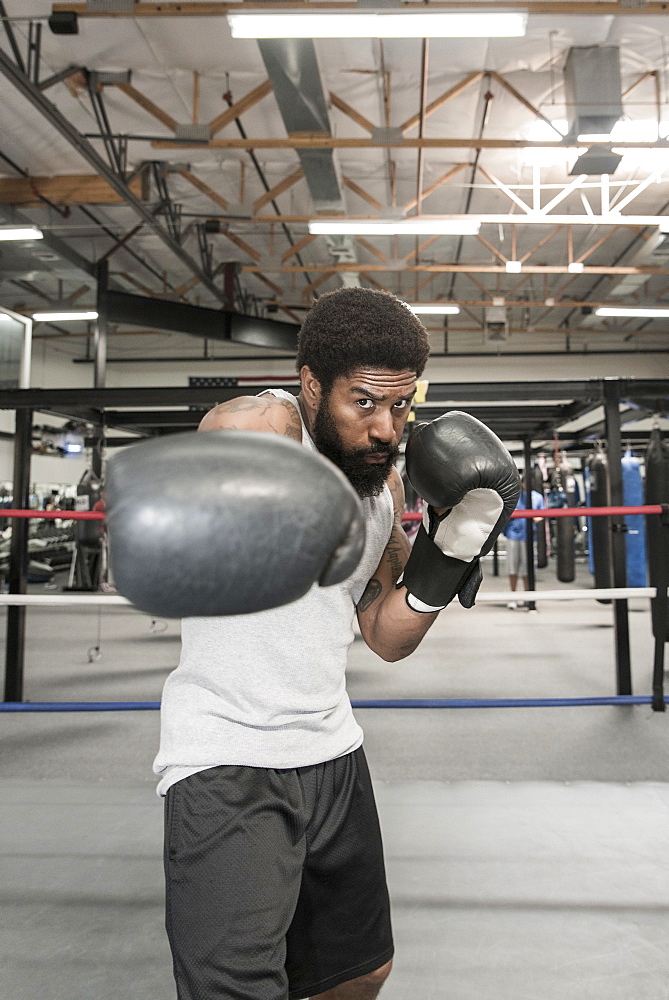 Black man posing in boxing ring