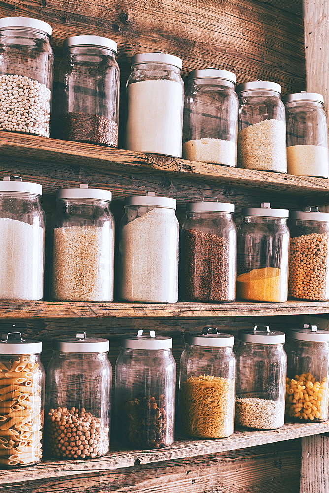 Jars of ingredients on wooden shelves